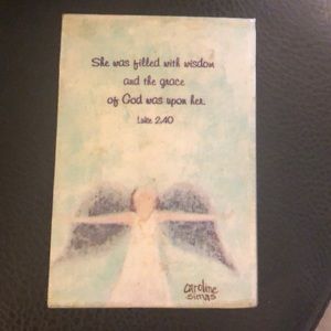 Angel artwork block with Luke 2.40